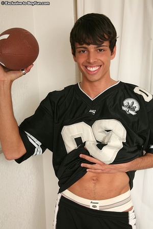Young football athlete take off his black uniform then expose his muscular body then strips down his white supporter and jacks his huge cock. - Picture 2