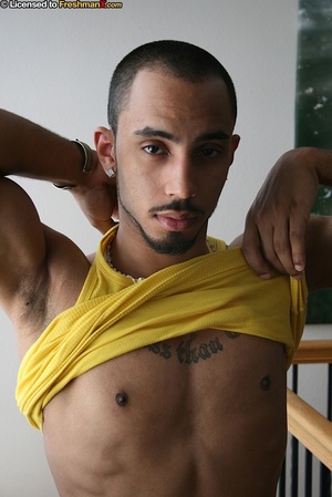 Hunk black dude peels off his yellow shirt and reveals his stud tattoooed body before he peels down his green and white checkered shorts and black boxers and reveals his giant cock. - Picture 5