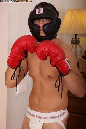 Hunk boxer displays his stunning body wearing his black head gear, red gloves, shorts and white supporter then gets naked and jacks off in his bedroom. - Picture 5