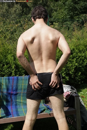 Hot dude takes of his black shirt and shows his skinny body outoor before he strips down his jeans and bares his butt hole and big cock on a wooden bench wearing his black brief. - Picture 10