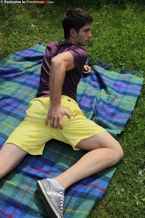 Sexy man peels off his purple shirt and displays his hard muscles before he pulls down his yellow shorts and reveals her long hard meat stick on a green and blue checkered blanket on a grass land. - XXXonXXX - Pic 5