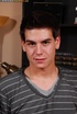 Pretty boy with hunk body slowly peels off his gray shirt, jeans and blue