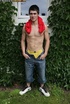 Foxy dude pulls up his red shirt and teases with his muscular body as
