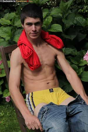 Foxy dude pulls up his red shirt and teases with his muscular body as he sits topless on a wooden chair before he peels down his jeans and yellow boxers and jacks his huge cock in a backyard. - XXXonXXX - Pic 8