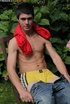 Foxy dude pulls up his red shirt and teases with his muscular body as