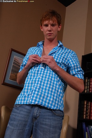 Gorgeous redhead takes off his blue and white checkered shirt and bares his stud body before he peels off his jeans and white brief and shows his long hard dick on a brown couch. - Picture 2