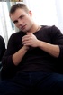 Handsome guy with stoney body peels off his black shirt then pulls his