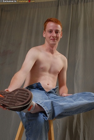 Young dude wearing brown shirt, black jacket, blue jeans, boxers and brown shoes slowly peel off his clothes and expose his skinny body and big dick as he sits naked on a brown stool. - XXXonXXX - Pic 6