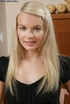 Young blonde babe gets naked to show her pink tits