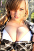 An innocent blonde with heavenly tits poses in her black and white plaid