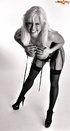 Black and white photoshoot of a pretty blonde in a black corset
