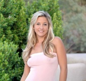 Cute teen blonde shows her erotic boobs and stimulating pussy as she pose