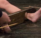 Hot bitch and her Master are into bastinado, and her tootsies get their