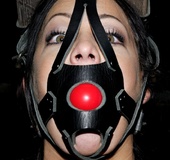 Partially dressed slave is able to see herself in a mirror while she is