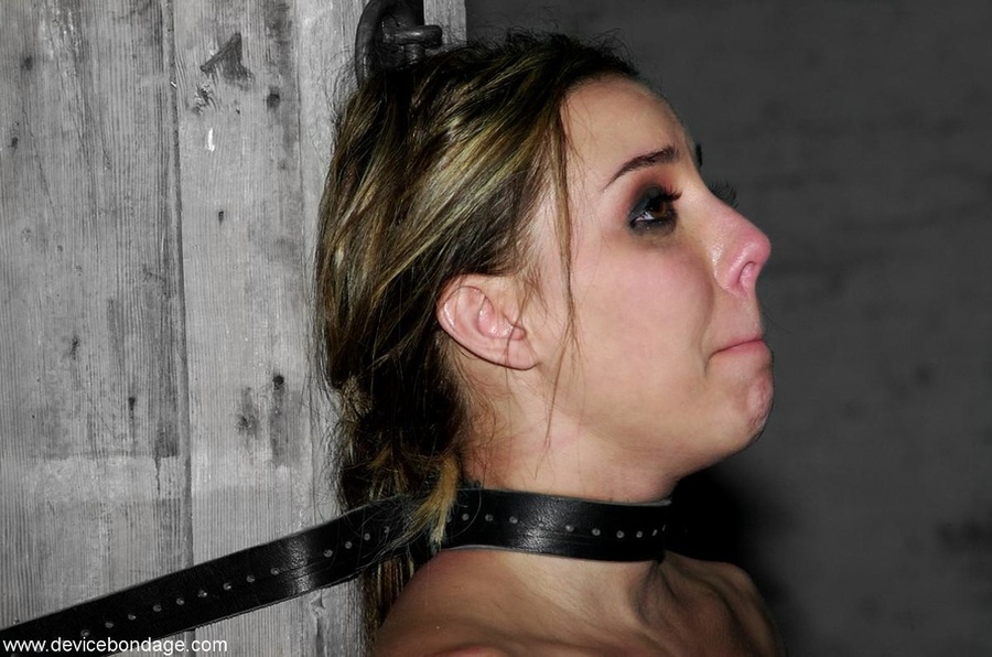 Young slave is bound to a pillar in a darkened space, but there is light on her pretty face. - XXXonXXX - Pic 9