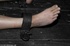 Young lady with long, dark locks loves to feel the pain of slave training