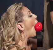 Enjoy an amazing shot of a hottie hung upside down on a wall, as all the