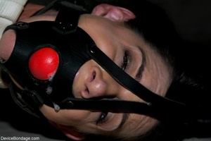 Gal with jet-black hair is unable to howl when she is hit, as there is a ball-gag in her mouth. - Picture 8