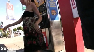 Gorgeous blonde wearing multi colored tube dress pulls down her black panty and reveals her indulging pussy on a gas station. - XXXonXXX - Pic 3