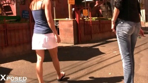 Foxy chick displays her stunning body in blue shirt in a public restaurant then shows her big tits before she spreads and screws her crack with a gray vibrator under her white skirt. - Picture 1