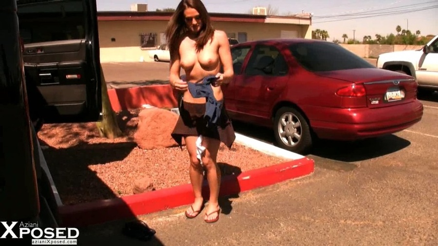 Alluring chick slowly strips off her blue shirt, brown skirt and white panty then expose her hot body with lusty boobs and sweet pussy as she pose naked in a parking lot. - XXXonXXX - Pic 4