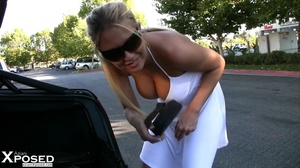 Banging blonde displays her lusty body as she walks around in public wearing her stunning white dress with sunglasses before she pulls up her skirt and expose her indulging pussy. - Picture 14