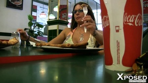 Stunning babe with foxy body in multi colored dress drives to a fast food then shows her lusty pussy underneath her table. - Picture 6