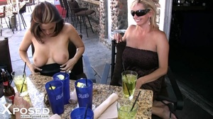 Steaming hot babes shows their indulging big boobs and sweet pussy wearing their black dress in an outdoor resraurant. - Picture 13