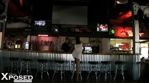 Stunning babe displays her hot curves wearing her sexy white dress while she drinks beer in a bar. - Picture 11