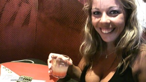 Busty blonde with gorgeous body in black blouse and multi colord skirt drinks punch with her hot friend before they show their humongous breasts in a bar. - Picture 1