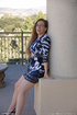 Playful honey with glasses shows her hairy twat outdoors