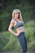 Beefy MILF blonde showing her sexy body outdoors