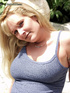 A nice blonde with beautiful blue eyes plays and caresses herself in the