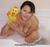 Excellent tawny shows her oral skills while sucking black dildo in bathtub