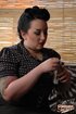 Chubby girl with black hair makes erotic smoke rings on camera