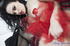 This hot showgirl in red tassles spreads her thighs to show off her tight
