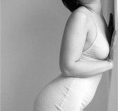 Stripper with highlighted hair and a tattoo takes off her bikini and gets