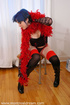 Thick gothic hottie in wet leather boots wraps red boa around her sweet