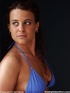 curly-haired temptress takes off