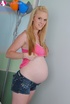 Pregnant blonde in a pink tank strips to play with her favorite toy