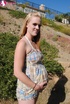 Pregnant blonde in cute plaid poses her luscious tits and pussy outside