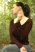 Brunette babe in brown top and tight-jeans enjoys sensual smoke in forrest