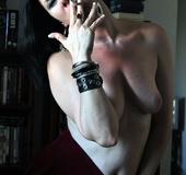 Black-haired goth-chick flaunts perky body and curvy ass whille smoking