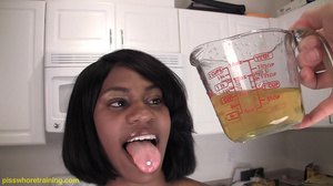 Gorgeous ebony slut pisses in jug and cums as she drinks her own piss - Picture 11