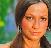 Pony tails, tattoo on upper back and pierced navel add to allure of hot