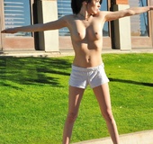 Naughty brunette jogger flashes pussy and strips in public showing round