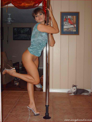 Steaming hot chick dances on a pole whil - Picture 15