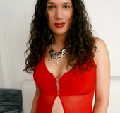 Curly haired honey takes off her red outfit