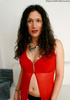 Curly haired honey takes off her red outfit