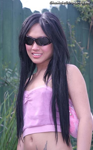 Slender brunette Asian tranny shows her  - Picture 1